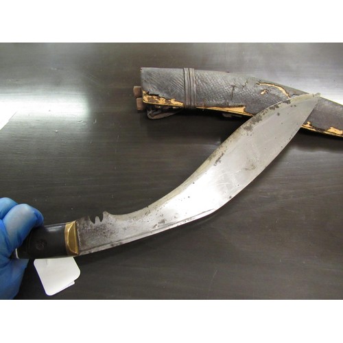 171 - 19th Century Indian kukri with a brass mounted horn grip in a leather mounted scabbard