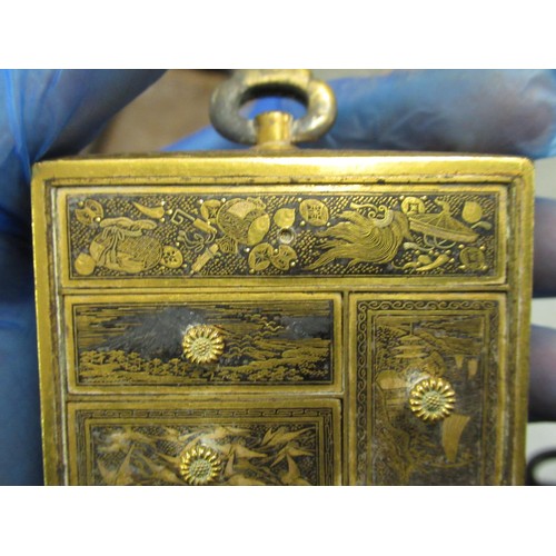 209 - Japanese gilt metal miniature four drawer table cabinet, together with a group of five small bronze ... 