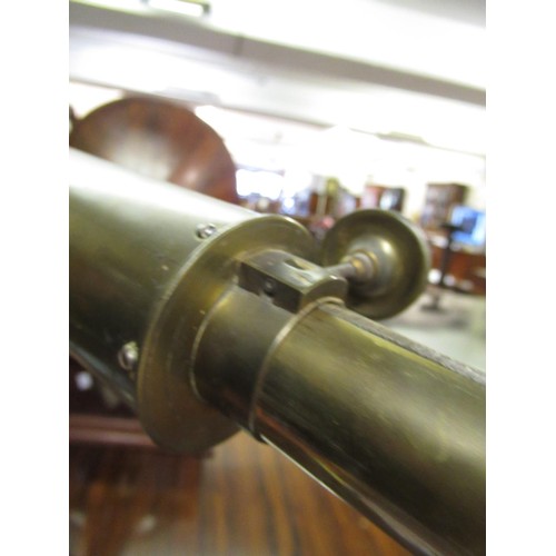 289 - Early 20th Century brass sighting scope mounted on an iron tripod stand