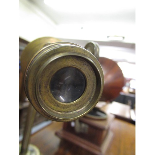 289 - Early 20th Century brass sighting scope mounted on an iron tripod stand