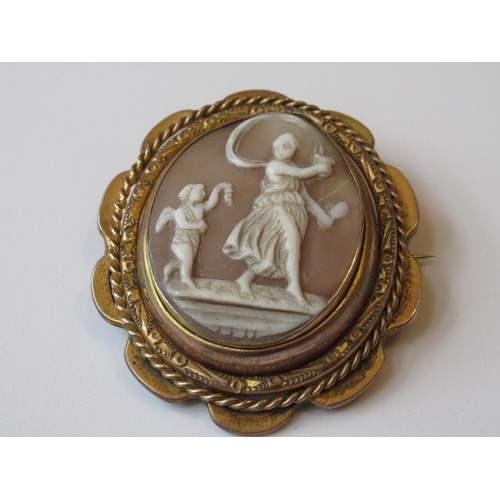 1051 - Large 19th Century gold plated cameo with swivel centre depicting a lady and child