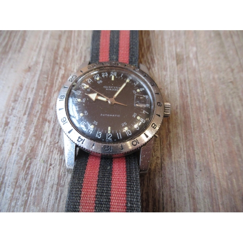 1086 - Gyycine Airman, gentlemans stainless steel wristwatch circa 1967, with black enamel 24 hour dial and... 