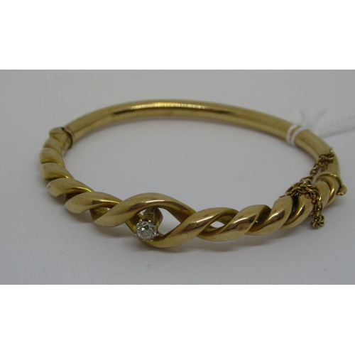 1106 - Victorian 15ct gold bangle of spiral twist design, set single diamond, approximately .35ct, Victoria... 