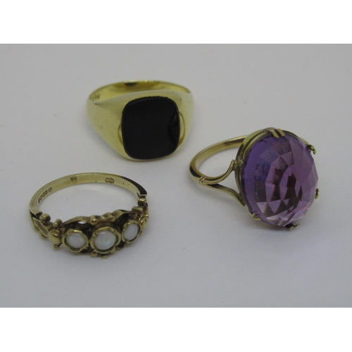 1114 - Two 9ct gold dress rings set opal and amethyst, together with a gentleman's yellow metal signet ring