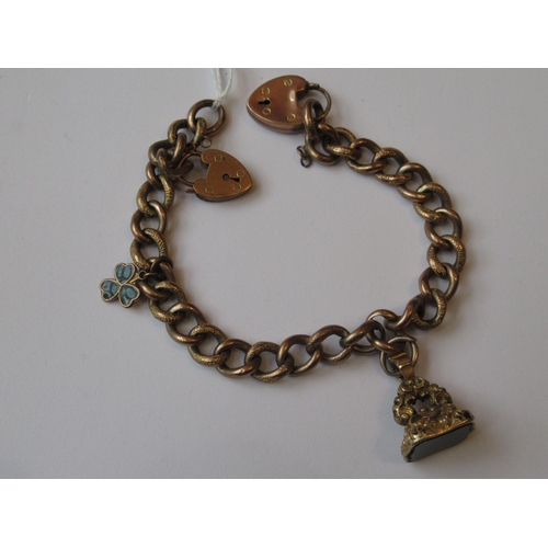 1128 - 9ct Gold curb link bracelet with two padlock clasps and an attached seal