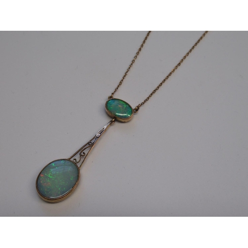 1150 - 9ct Gold mounted opal pendant on chain