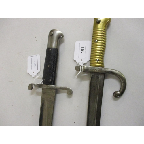 101 - French 1872 pattern bayonet with brass grip together with a similar British bayonet