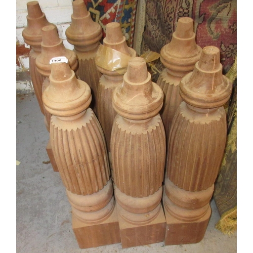 1400 - Set of eight reproduction mahogany table legs of turned fluted design, 27ins high