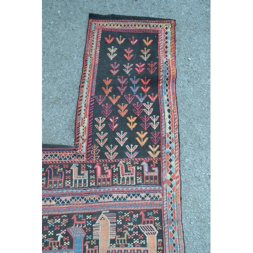 21 - Soumak Caucasian horse rug of irregular form worked with various stylised animal and flower designs ... 