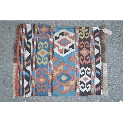 23 - Group of four small Kelim mats