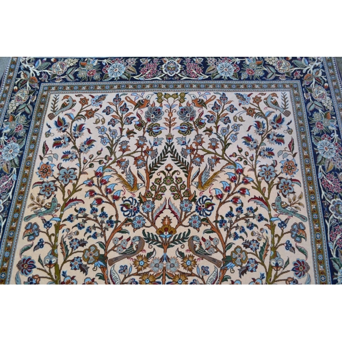 31 - Modern Qum style rug with a tree of life design on an ivory ground with floral borders, 8ft 6ins x 5... 