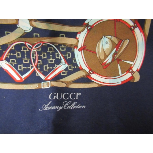 58 - Gucci Accessory Collection, navy blue equestrian design scarf, 34ins x 34ins