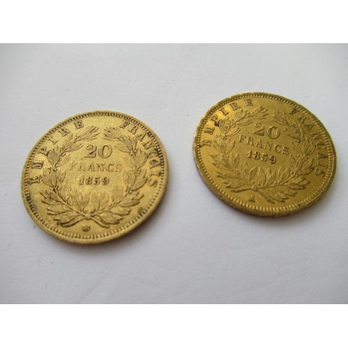 581 - Two French twenty franc gold coins, 1859