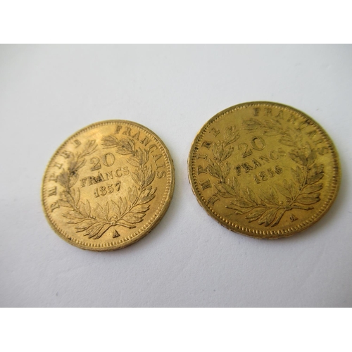 584 - Two French twenty franc gold coins, 1856 and 1857