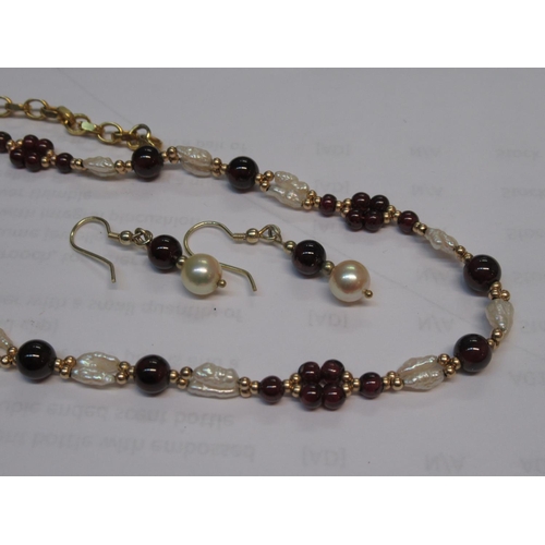 596 - Silver gilt and freshwater pearl necklace together with a pair of similar earrings