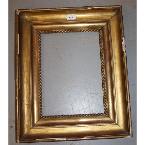 616 - 19th Century gilt moulded picture frame, aperture 13ins x 9.5ins (at fault) together with a framed p... 