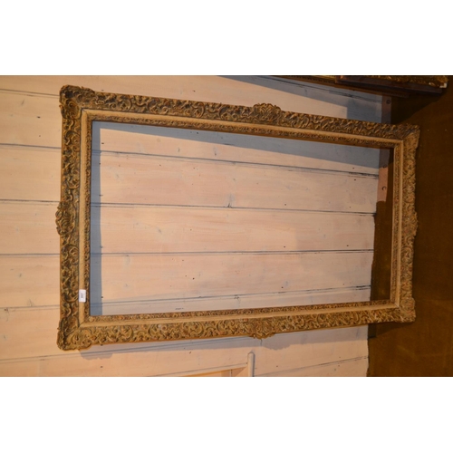 657 - Large rectangular swept gilt picture frame, 45.5ins x 25ins rebate, together with five other various... 