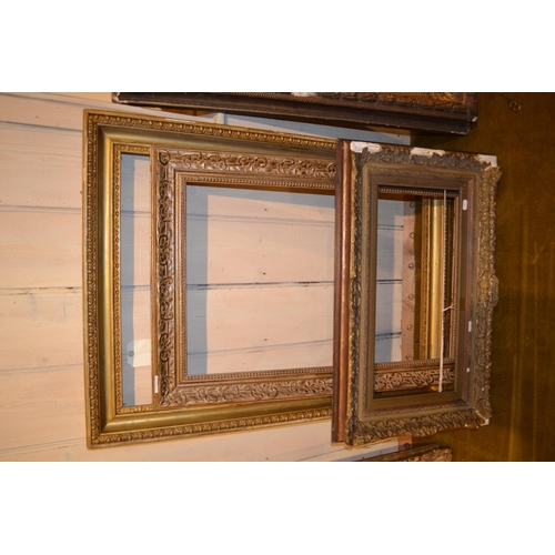 657 - Large rectangular swept gilt picture frame, 45.5ins x 25ins rebate, together with five other various... 