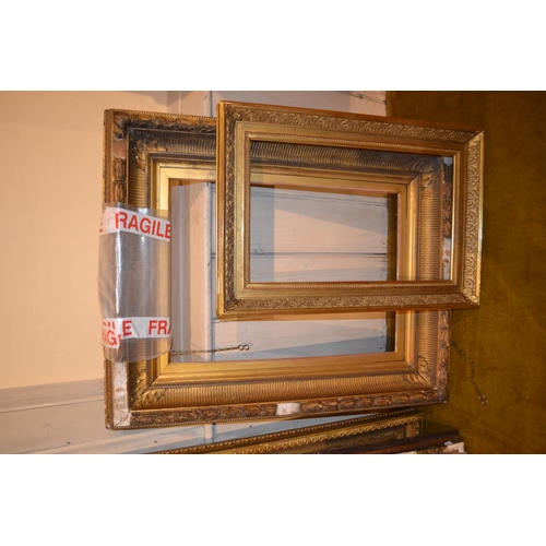 657 - Large rectangular swept gilt picture frame, 45.5ins x 25ins rebate, together with five other various... 