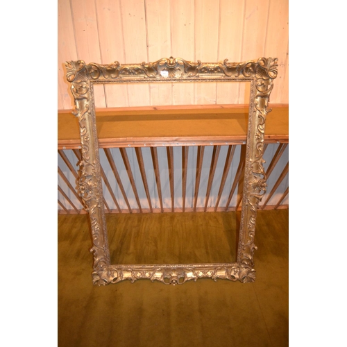 662 - Large rectangular swept gilt picture frame, 45ins x 33.5ins rebate, together with three other simila... 