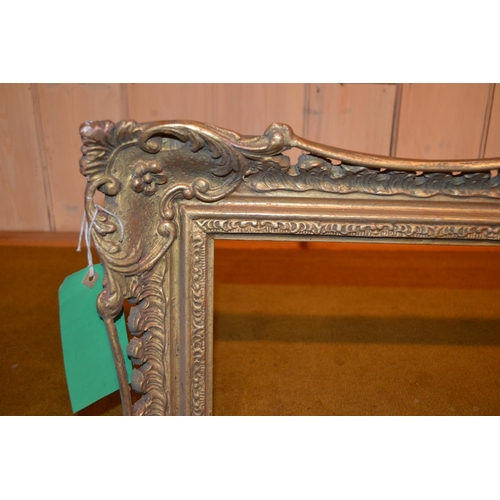 663 - Swept gilt picture frame, 43.75ins x 27.75ins rebate together with four other various frames