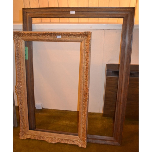 663 - Swept gilt picture frame, 43.75ins x 27.75ins rebate together with four other various frames