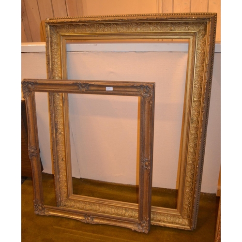 663 - Swept gilt picture frame, 43.75ins x 27.75ins rebate together with four other various frames