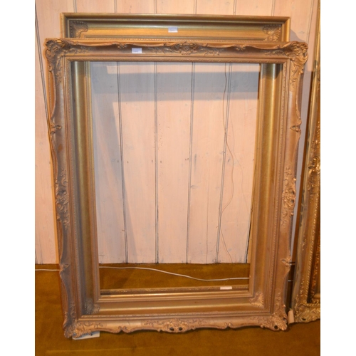 664 - Large gilt picture frame in French Empire style, 50ins x 40ins rebate, together with five other vari... 