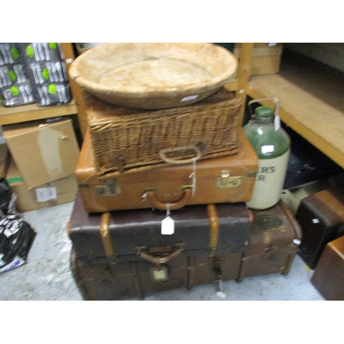 91 - Three various suitcases, a basket, a circular wooden shallow bowl and a Bulmers cider stoneware flag... 