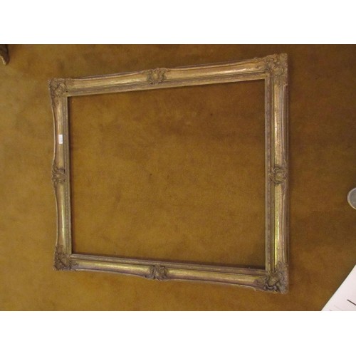 663 - Swept gilt picture frame, 43.75ins x 27.75ins rebate together with four other various frames