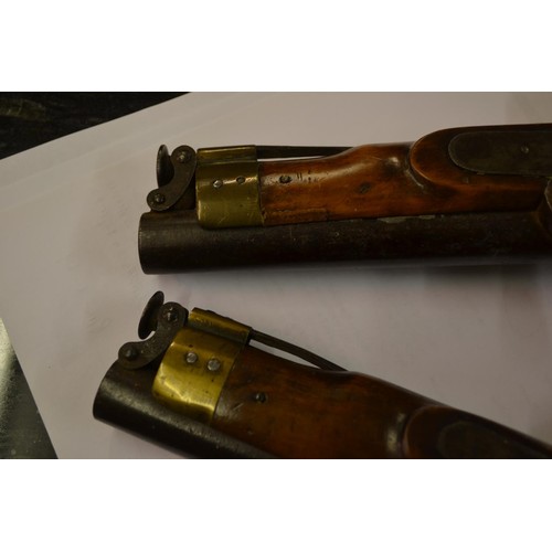 106 - Near pair of small 19th Century percussion pistols with integral ramrods and lanyard rings, engraved... 