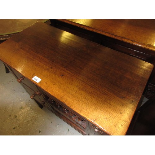 1388 - Good quality reproduction oak aumbry, the plank top above two small drawers and a pierced and panel ... 