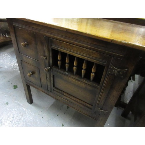 1388 - Good quality reproduction oak aumbry, the plank top above two small drawers and a pierced and panel ... 