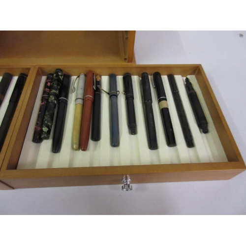 223 - Small wooden glazed display case containing a quantity of vintage fountain pens