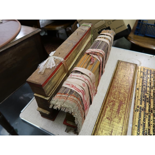 254 - Buddhistic prayer book / mantra of multiple pages between red and gilt lacquer boards, together with... 