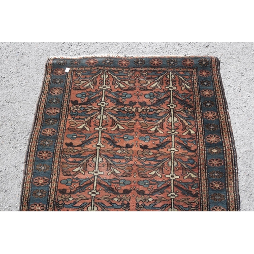 3 - Small Kurdish rug with an all-over stylised floral design on a brick red ground with borders, 4ft 8i... 