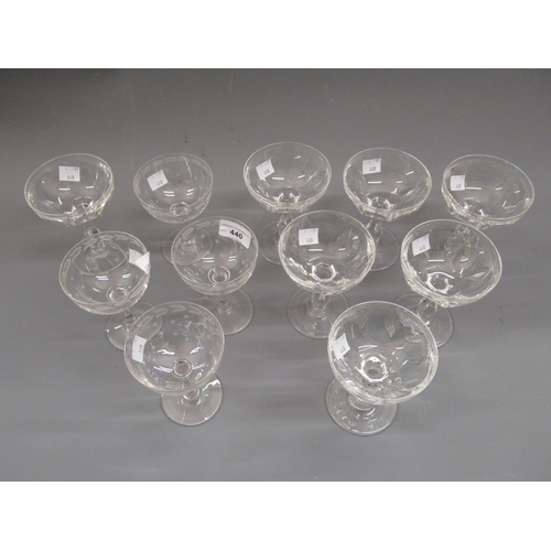 440 - Set of seven 19th Century faceted glass Champagne cups (three with chips), together with four etched... 