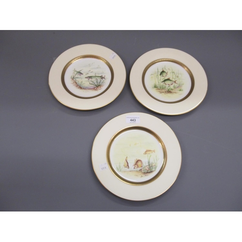 443 - Set of three Coalport cabinet plates, each painted with fish within a gilt and yellow border, signed... 