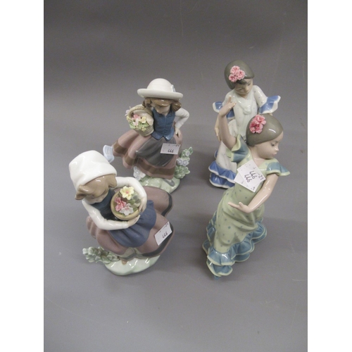 446 - Pair of small Lladro figures of Spanish dancers, together with a pair of similar figures of girls wi... 