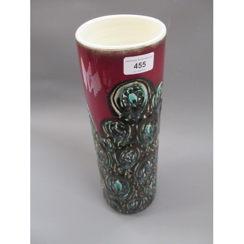 455 - Mid 20th Century Poole pottery vase of cylindrical tapering form with stylised decoration on a red g... 