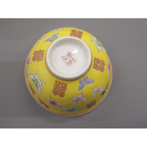 487 - Set of four Chinese rice bowls decorated with butterflies and moths on a yellow ground , signed with... 