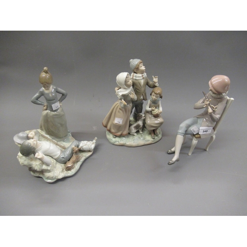 540 - Lladro group of a boy and a girl with their dog, 10ins high together with a Lladro figure of a seate... 