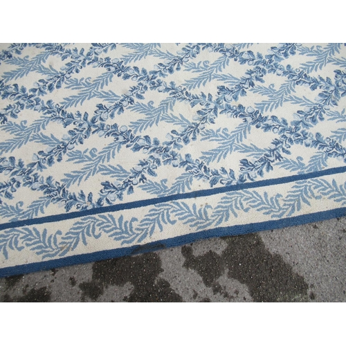 7 - Large modern Chinese machine woven carpet with an all-over blue floral lattice design on an ivory gr... 