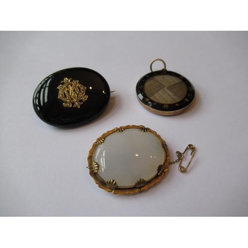 722 - 19th Century circular hair inset memorial pendant together with a 19th Century memorial brooch and a... 