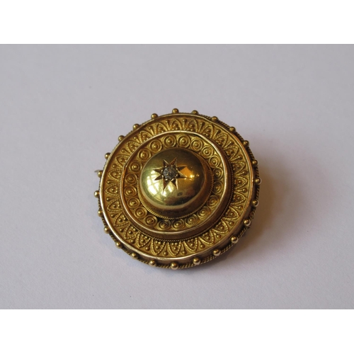 723 - Victorian circular gold Etruscan style brooch set diamond chip