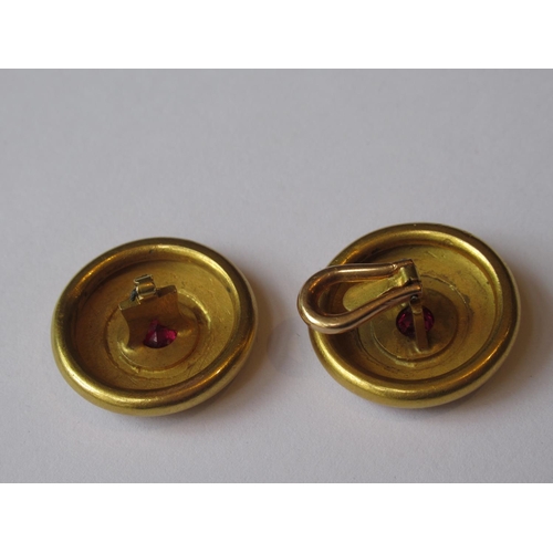 724 - Pair of Victorian circular gold ruby set ear clips (one at fault)