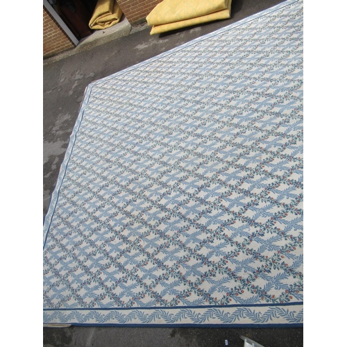 9 - Very large modern Chinese machine woven carpet with an all-over blue floral lattice design on an ivo... 