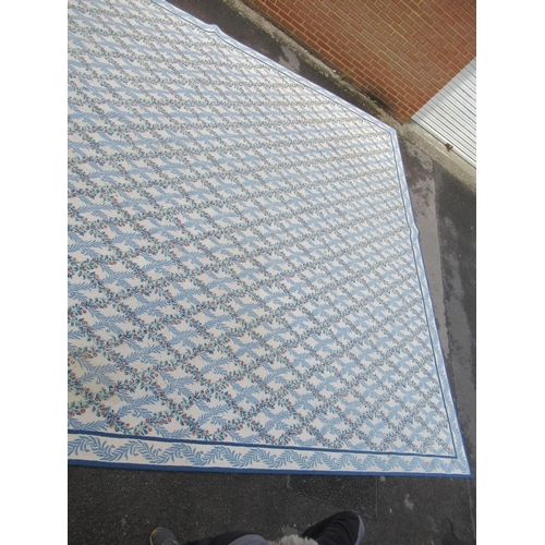 9 - Very large modern Chinese machine woven carpet with an all-over blue floral lattice design on an ivo... 