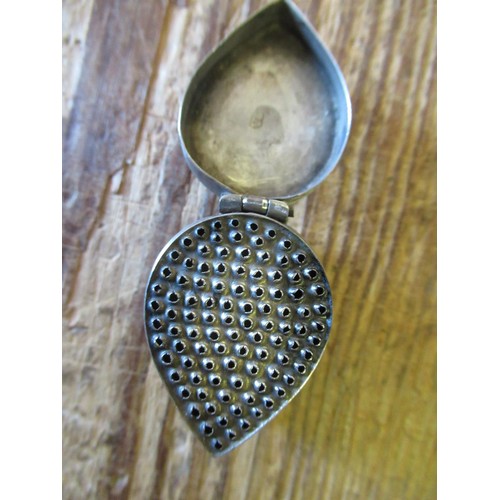 610 - 18th Century white metal nutmeg grater of tear drop form with engraved stylised floral decoration, m... 