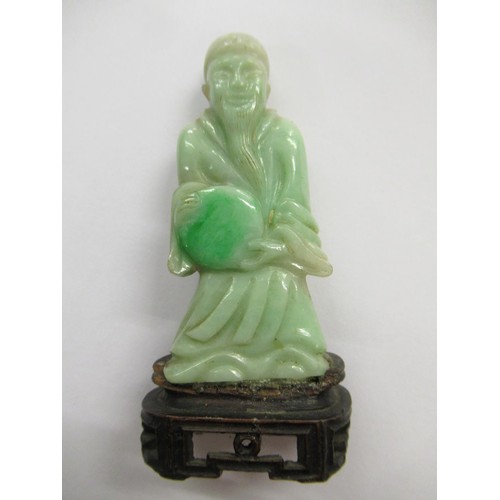 240 - Small Chinese carved jadeite figure of an immortal on a hardwood stand, 3ins tall overall together w... 